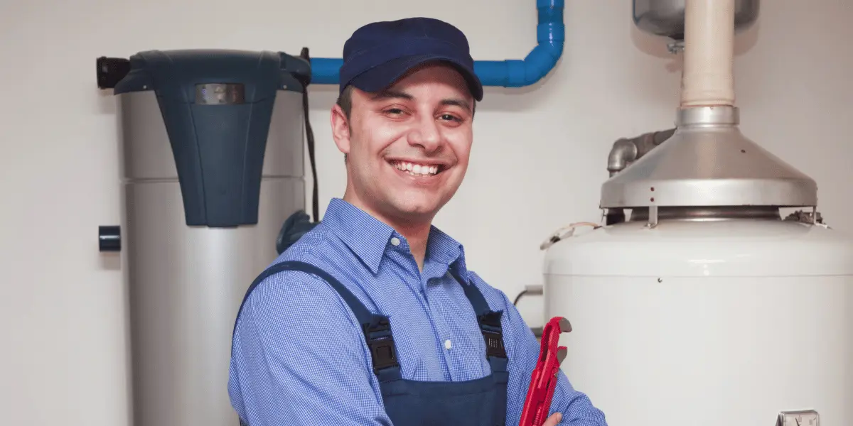 Plumber successfully repairing a burst pipe in a Dallas home